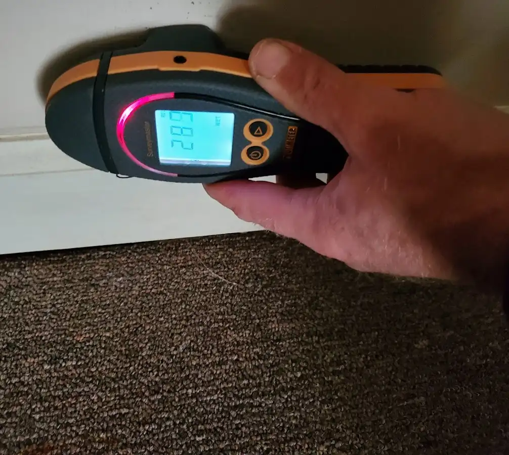 Moisture detection at baseboard during Storm Damage Restoration in Dardenne Prairie